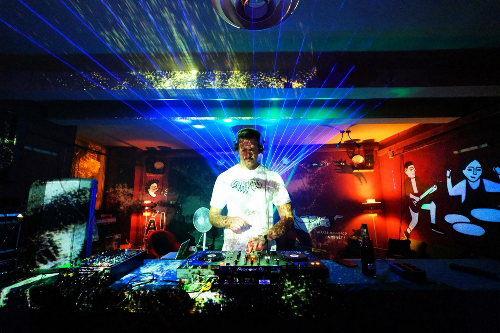 Projection-mapped visuals over a DJ booth at the Zsolnay Light Festival